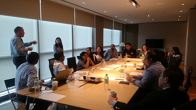 Martin Polaine speaking with attendees and Chooi partners